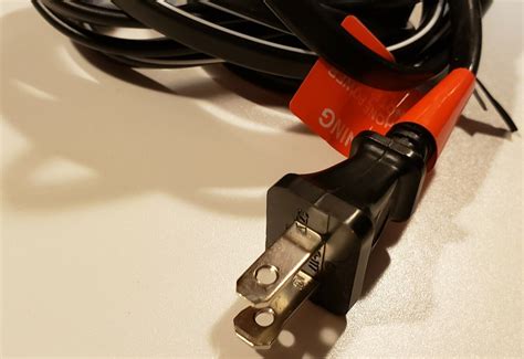 Un-clip, unscrew, or de-solder the <b>cord's</b> connectors from the device. . 18awgx2c power cord